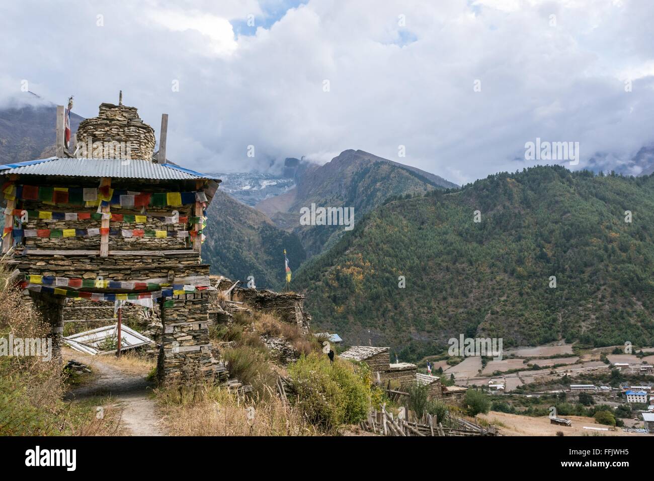 Colorful ornate buddhist stupa. Traditional village entrance in Nepal ...