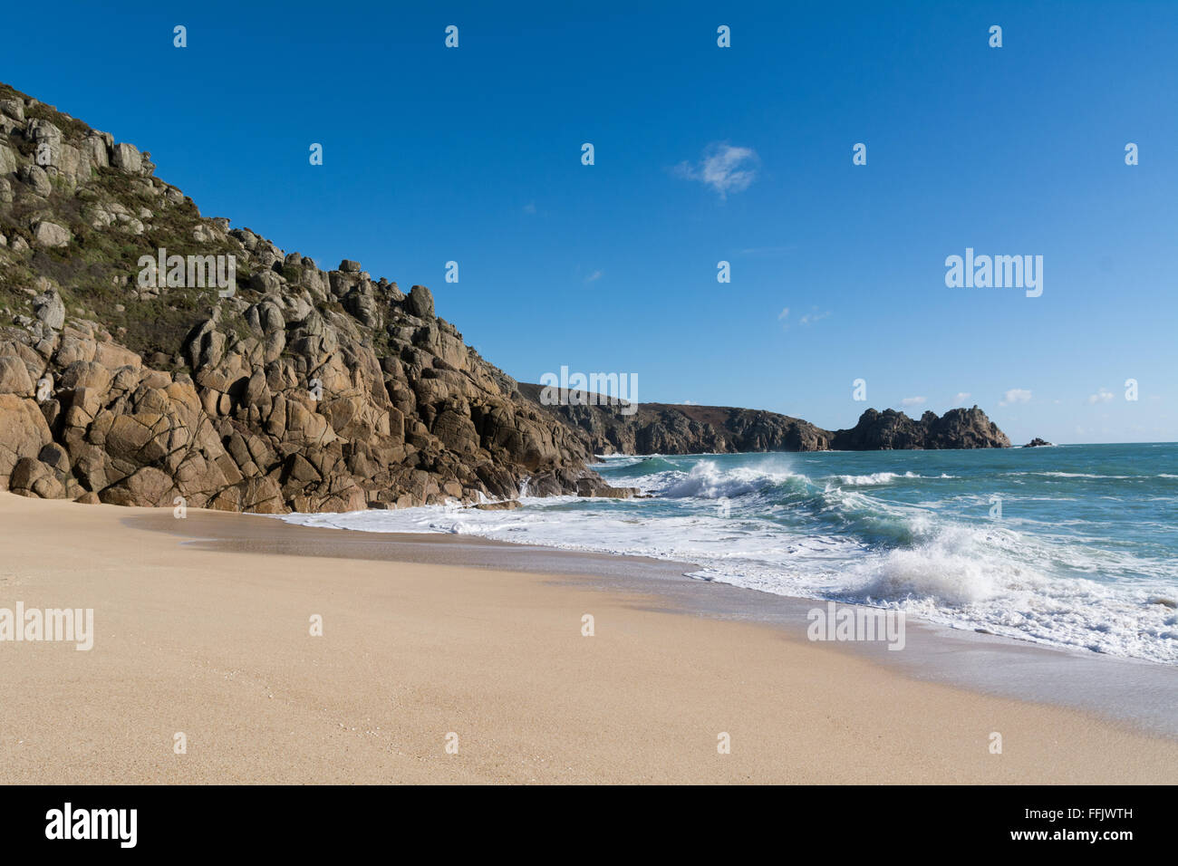 Porthcurno, Cornwall, UK. 15th February 2016. UK Weather. Bright sunshine on Porthcurno beach, sheltered from the northerly winds, for the start of half term week. Credit:  Simon Maycock/Alamy Live News Stock Photo