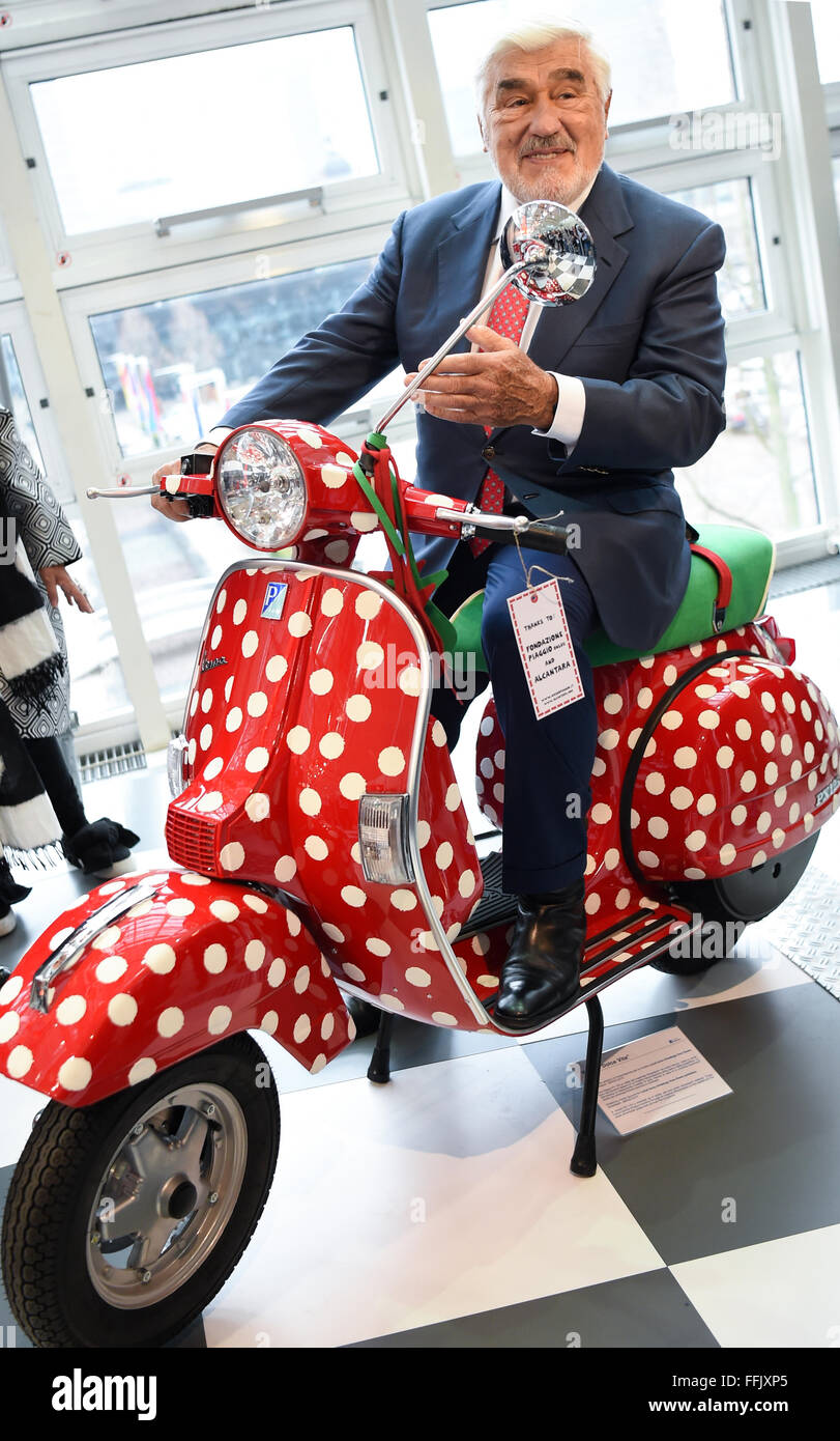 Actor Mario Adorf poses on the Vespa PX 125 'Dolce Vita' at the joint Italian stand of the Ambiente consumer goods fair in Frankfurt/Main, Germany, 15 February 2016. Italy is this year's host country. Photo: Arne Dedert/dpa Stock Photo