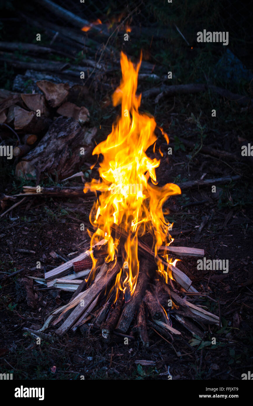 Portrait image of a camp fire at sunset Stock Photo