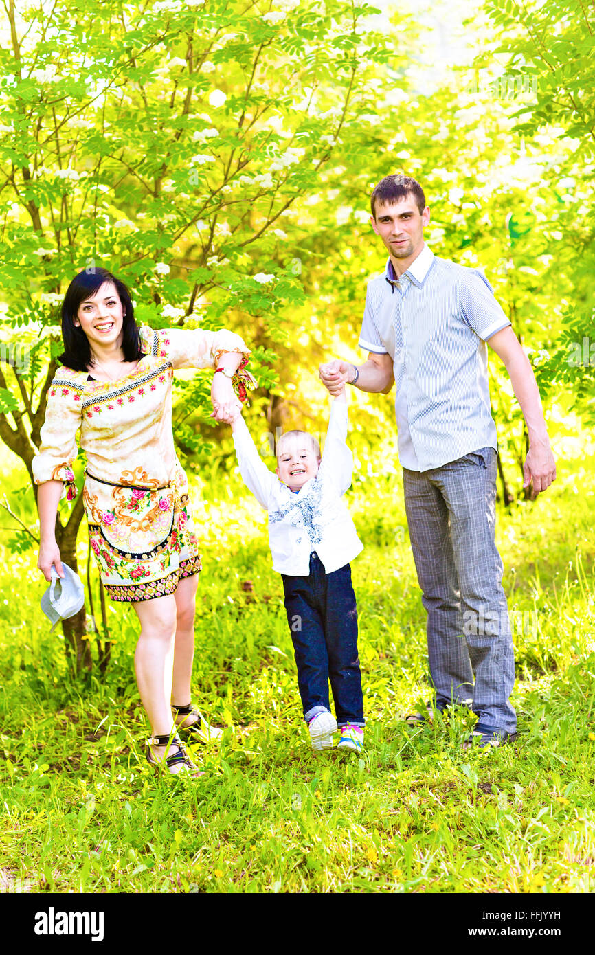 Happy family in a park Stock Photo - Alamy