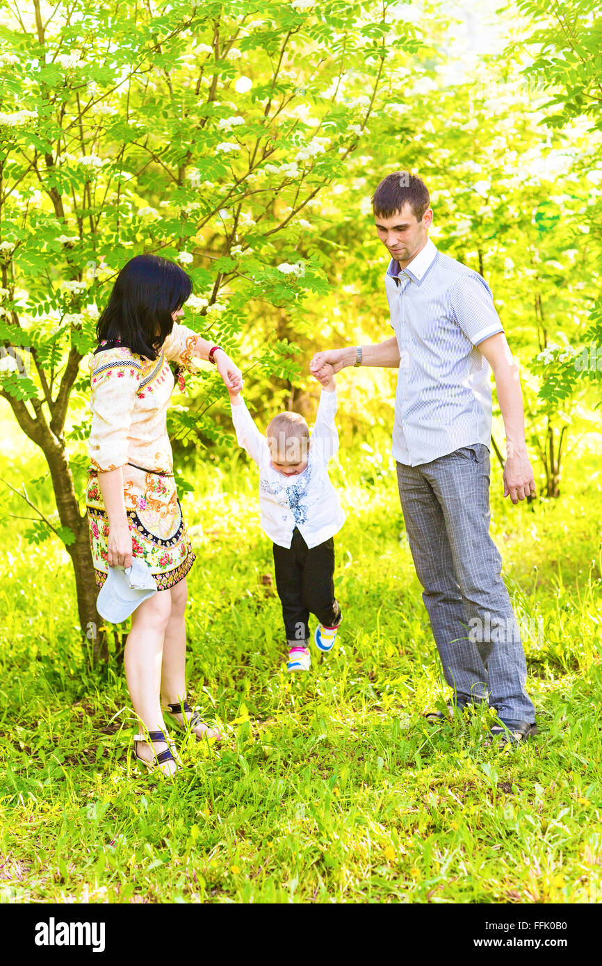 Happy family in a park Stock Photo - Alamy