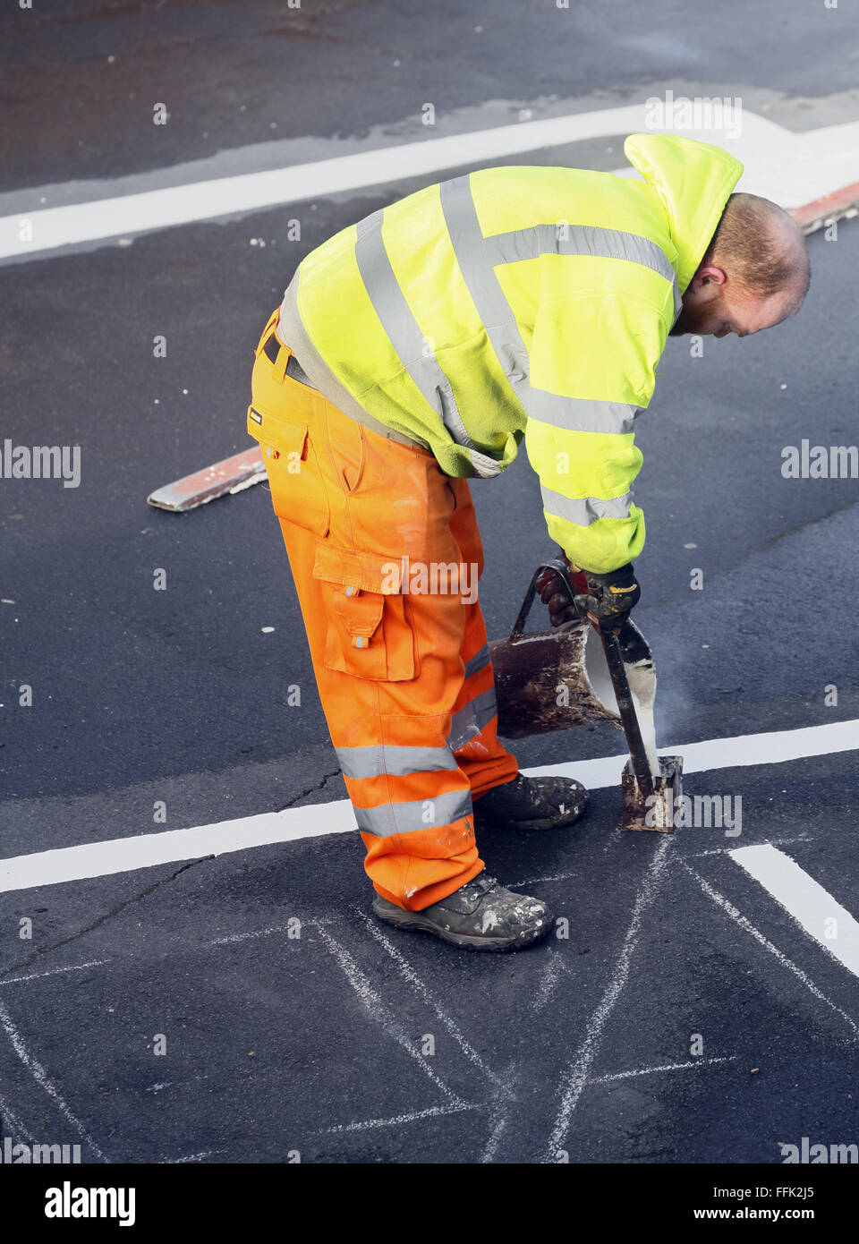 Contractor road marking in a public car park. Stock Photo