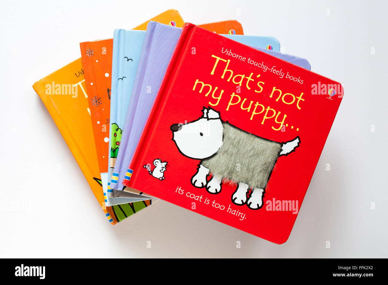 Pile of children's books in That's not my series Usborne touchyfeely books isolated on white