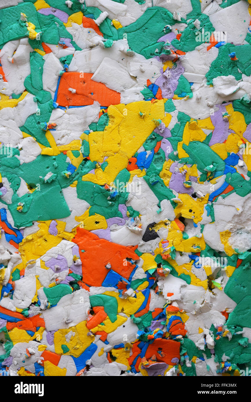 Multicolor pressed polystyrene recycled panel of different pieces utilized for construction and packaging Stock Photo