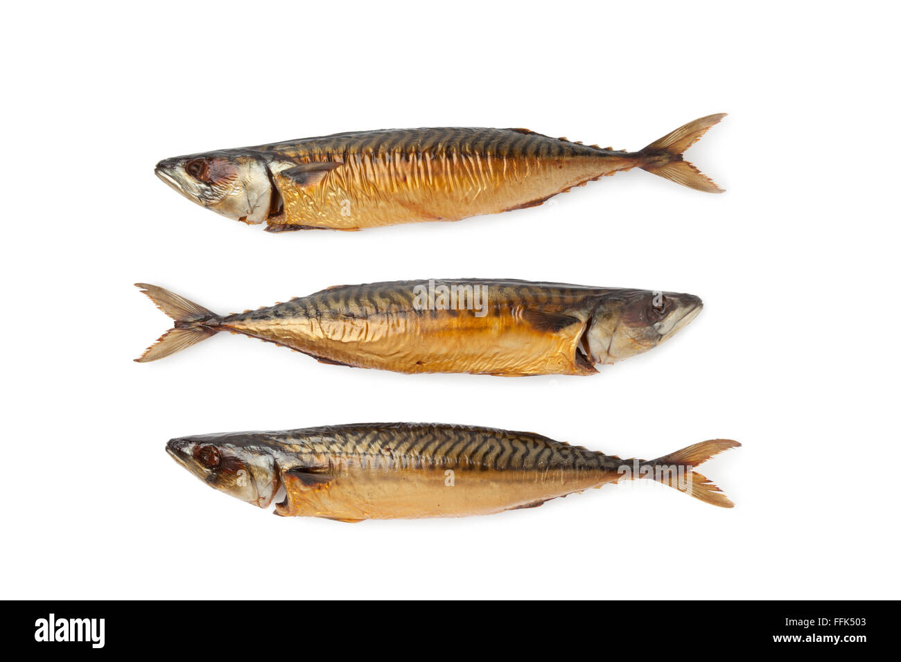 Whole fresh steamed and smoked mackerel fishes isolated on white background Stock Photo