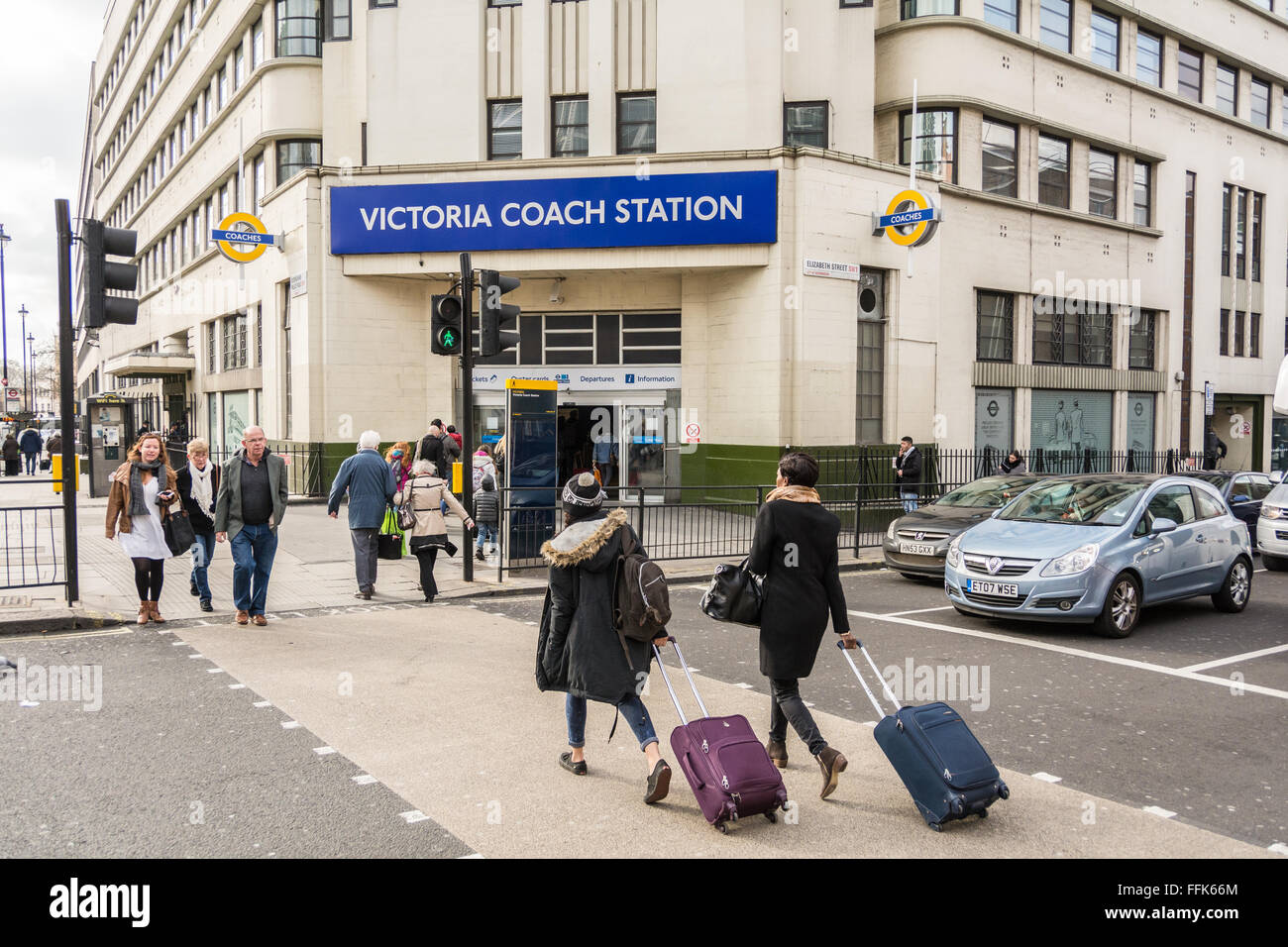 Tourists pass in front of the exterior of Victoria Coach Station in central London, UK Stock Photo