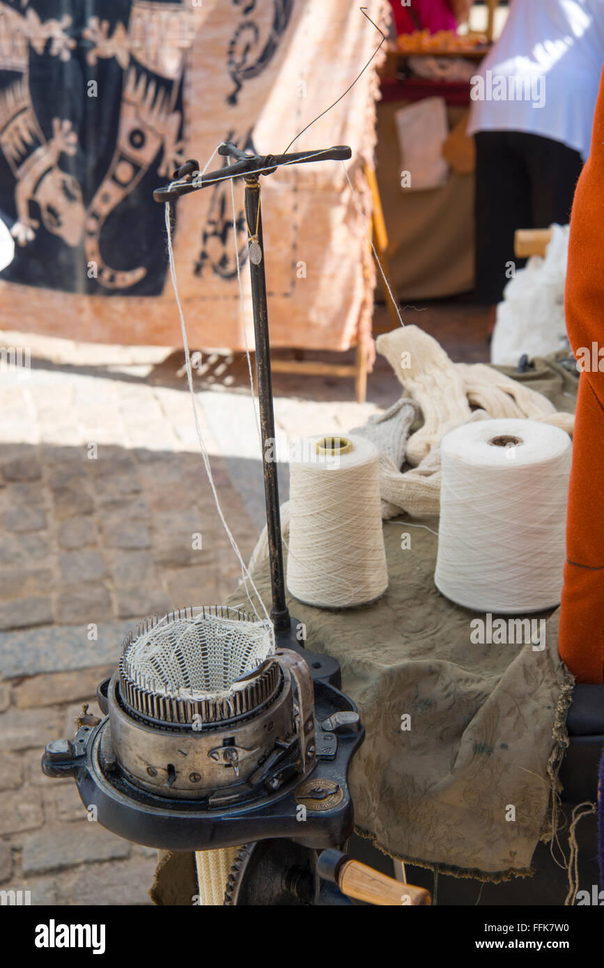 Loom and rolls of thread. Medieval flea market, Doña Urraca Square, Covarrubias, Burgos province, Castilla Leon, Spain. Stock Photo