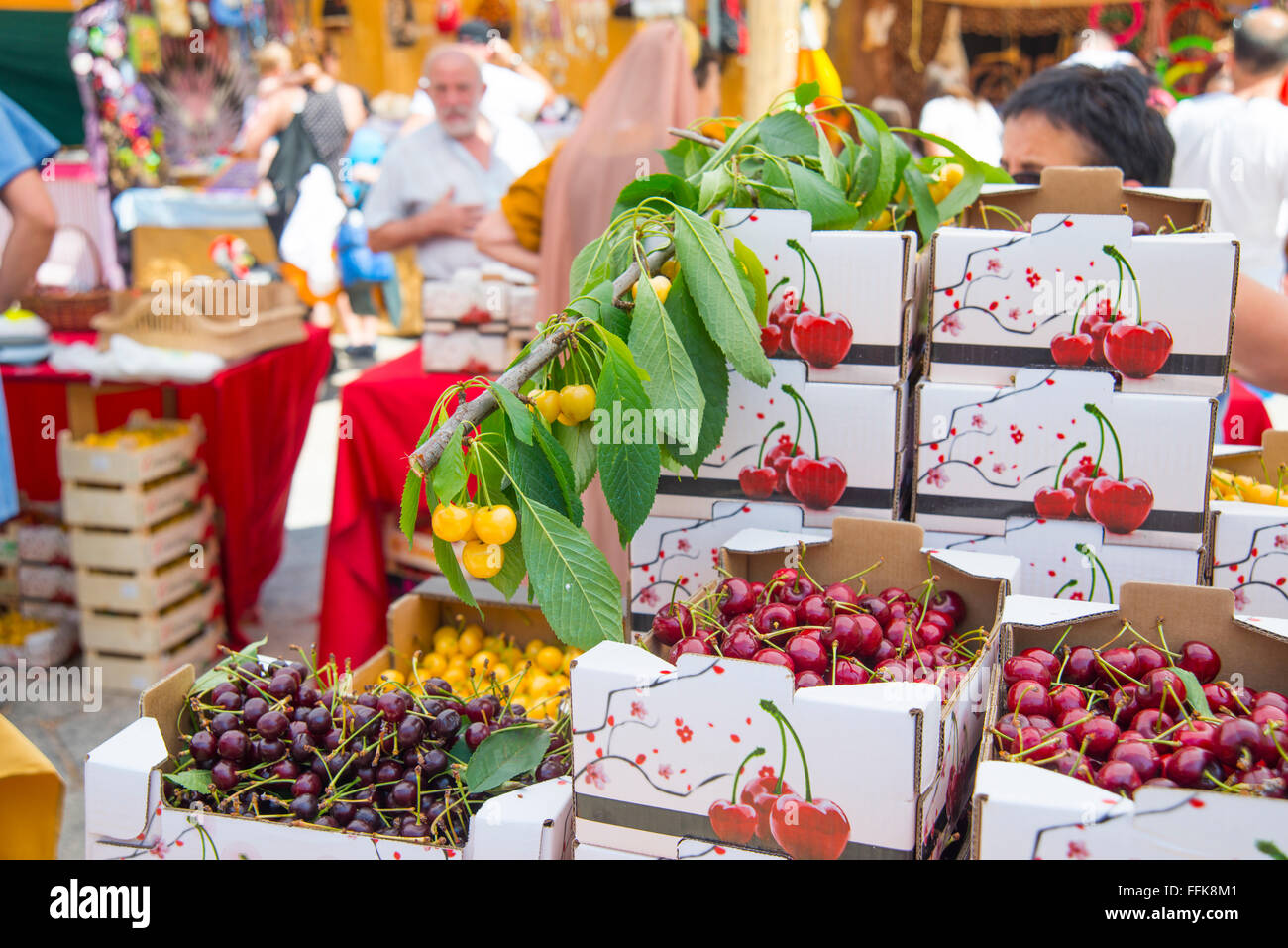 Cherries in vendor stall of flea market. Cherry Festival, Covarrubias