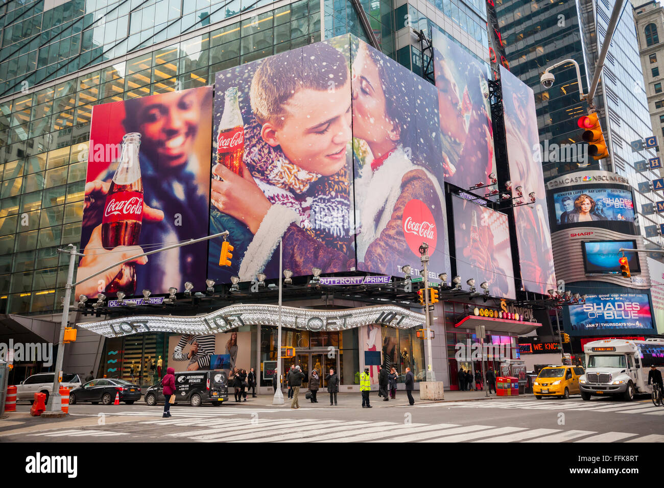 A winter themed Coca-Cola billboard dominates a Times Square intersection in New York on Tuesday, February 9, 2016. Fourth-quarter profits for Coca-Cola rose despite a drop in Diet Coke sales. Global volume rose as consumers reached for healthier alternatives to soda. (© Richard B. Levine) Stock Photo