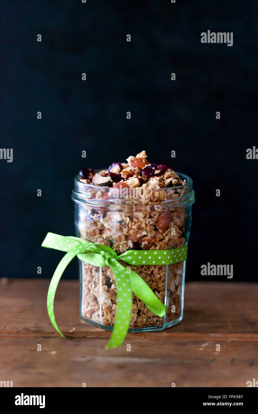 Almonds and cranberries homemade granola in a glass jar Stock Photo Alamy