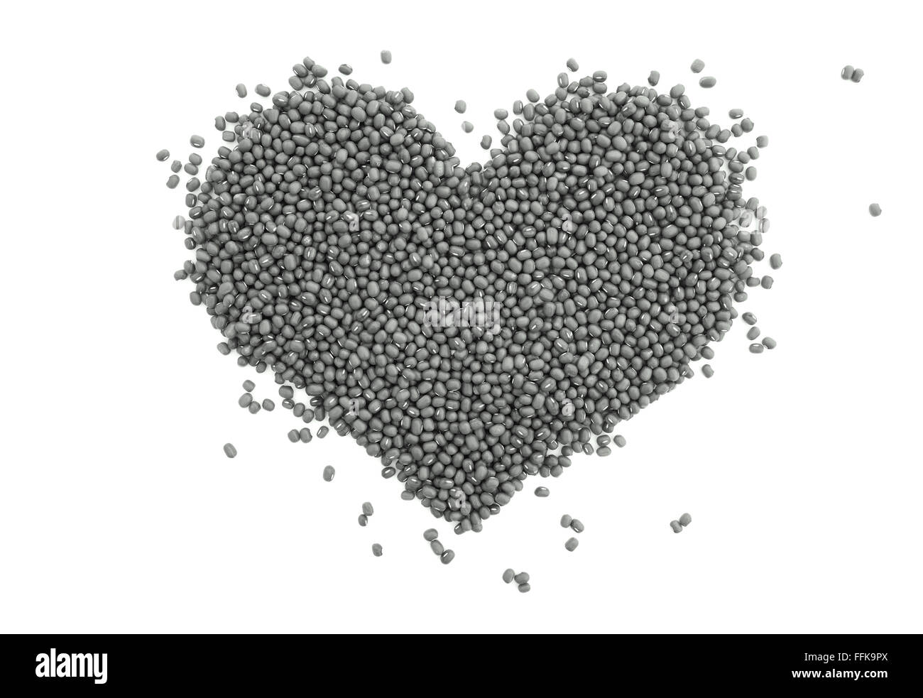 Mung beans in a heart shape, isolated on a white background - monochrome processing Stock Photo