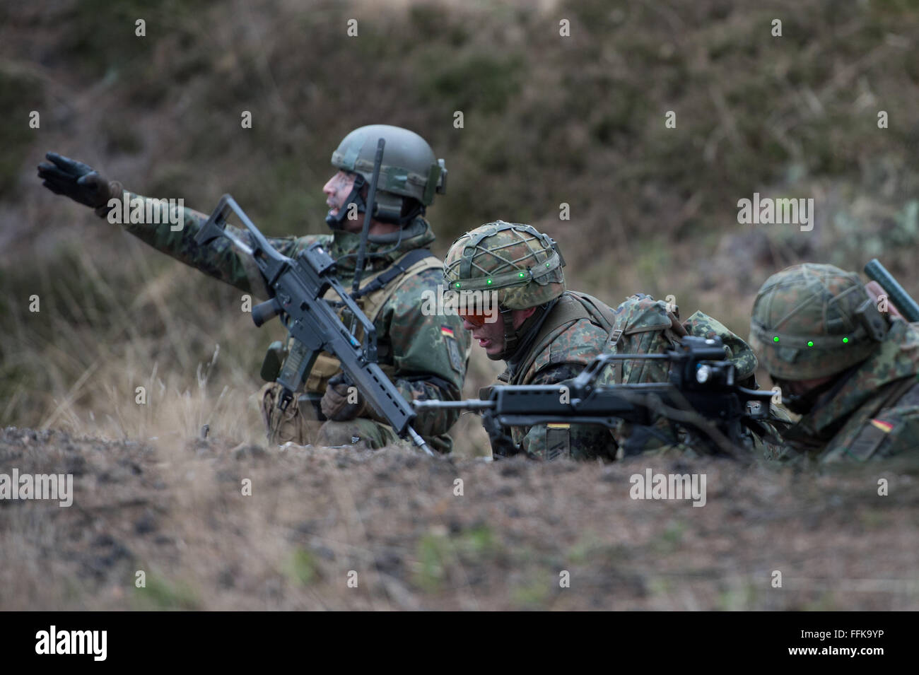 German armoured infantrymen practicing a military mission on the military training ground Oberlausitz near Werdeck, Germany, 9 February 2016. Photo: Arno Burgi Stock Photo