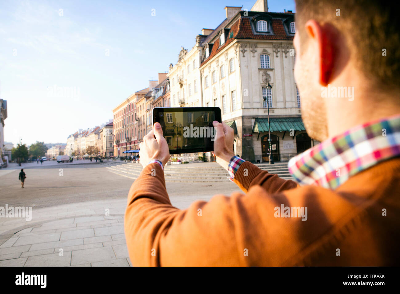Man on a city break taking a picture with smart phone Stock Photo