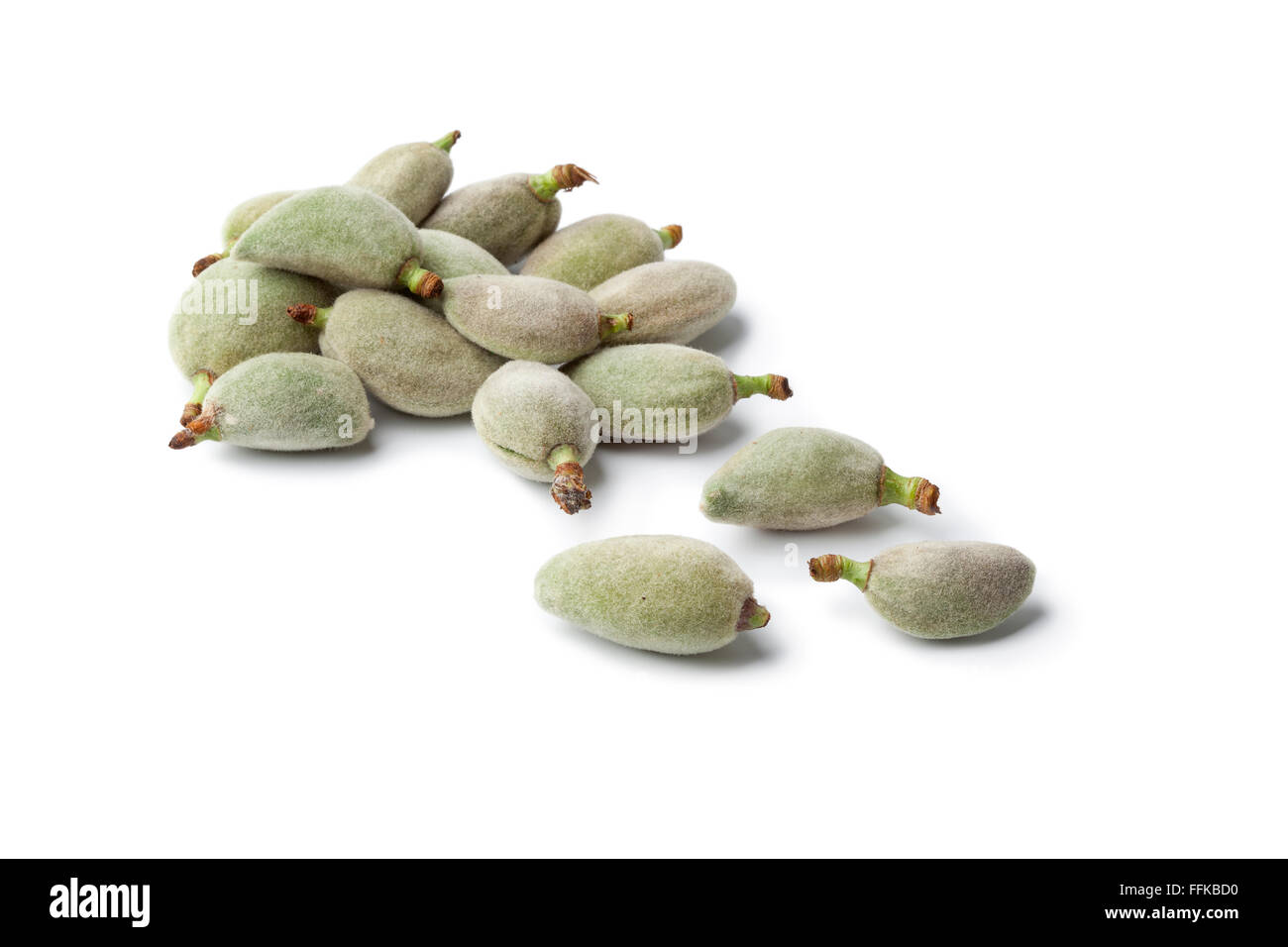 Fresh raw bitter almonds in the pod on white background Stock Photo