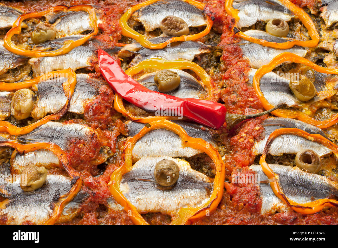Traditional Moroccan sardine dish receipe with olives, bell peppers and chili peppe full frame Stock Photo