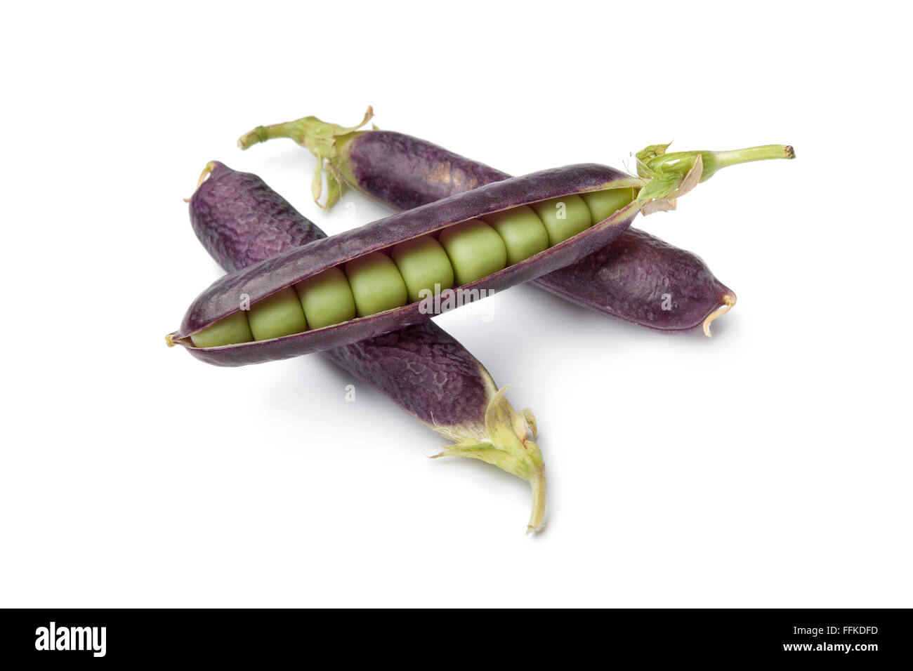 Fresh peas in purple pod on white background Stock Photo