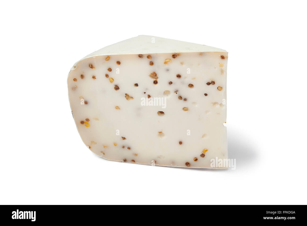 Piece of Goats cheese with Coriander and Fenugreek on white background Stock Photo