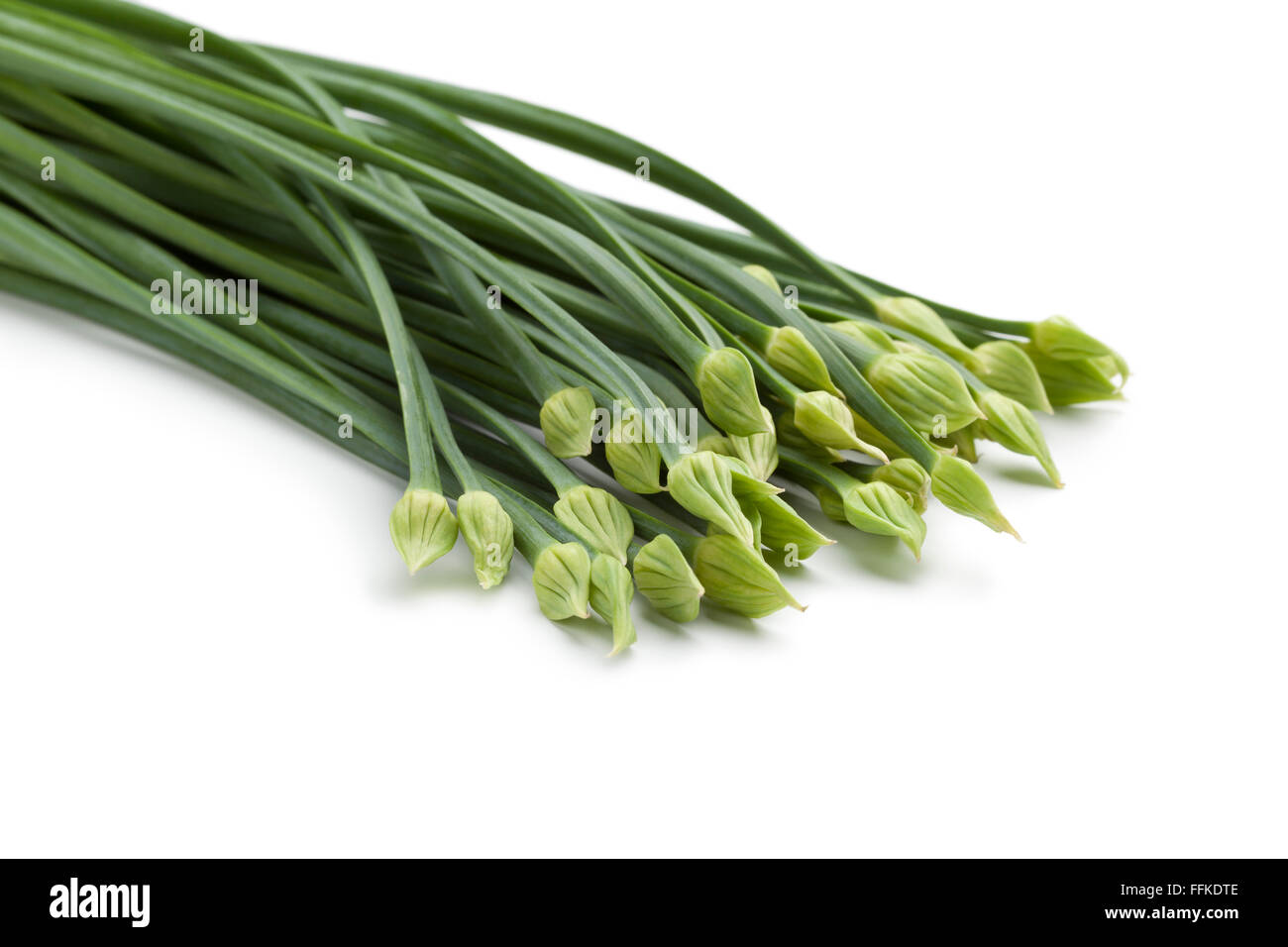 Fresh chinese garlic chives on white background Stock Photo Alamy