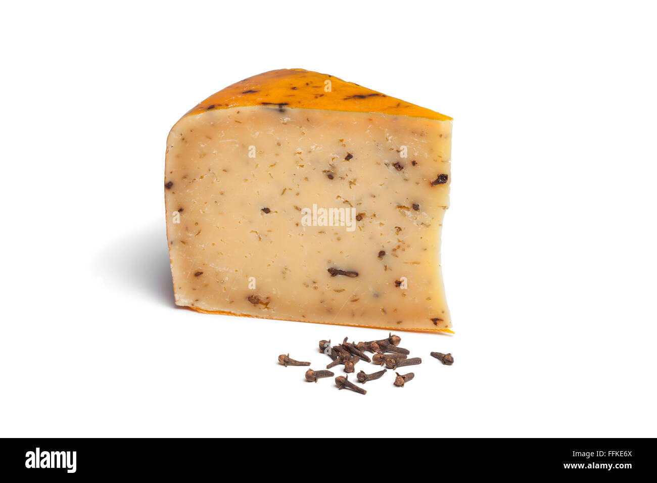 Traditional Dutch Cheese with cumin and cloves on white background Stock Photo