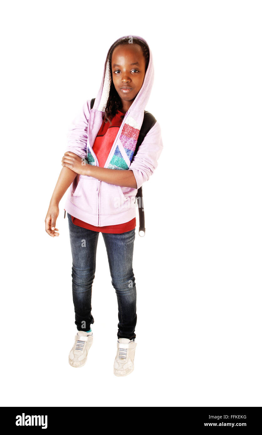 A young pretty black girl in jeans and a pink jacket standing for white  background in the studio, ready for school Stock Photo - Alamy