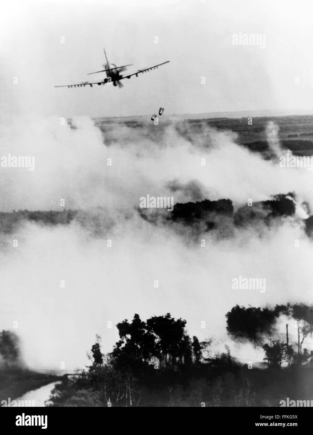 Vietnam War. Vietnamese Air Force A-1E Skyraider bombing a Viet Cong hideout near Cantho, South Vietnam during the Vietnam War. Photo c.1967 by USAF. Stock Photo