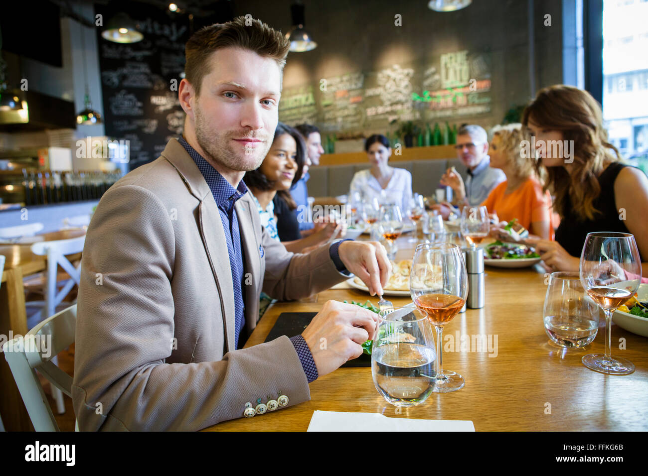 Group of friends celebrating in restaurant Stock Photo