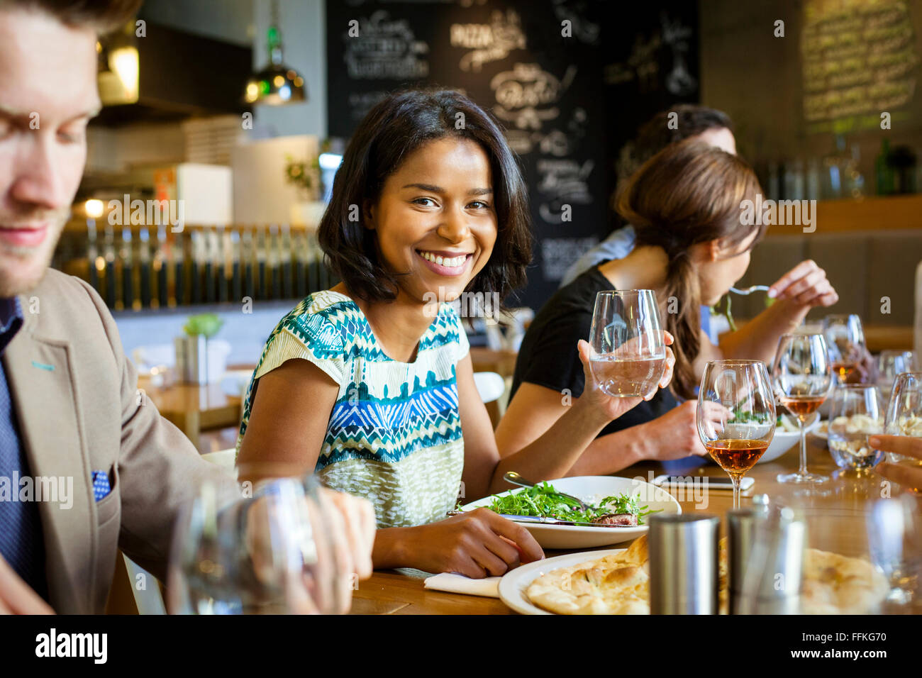 Group of friends on dinner party in restaurant Stock Photo