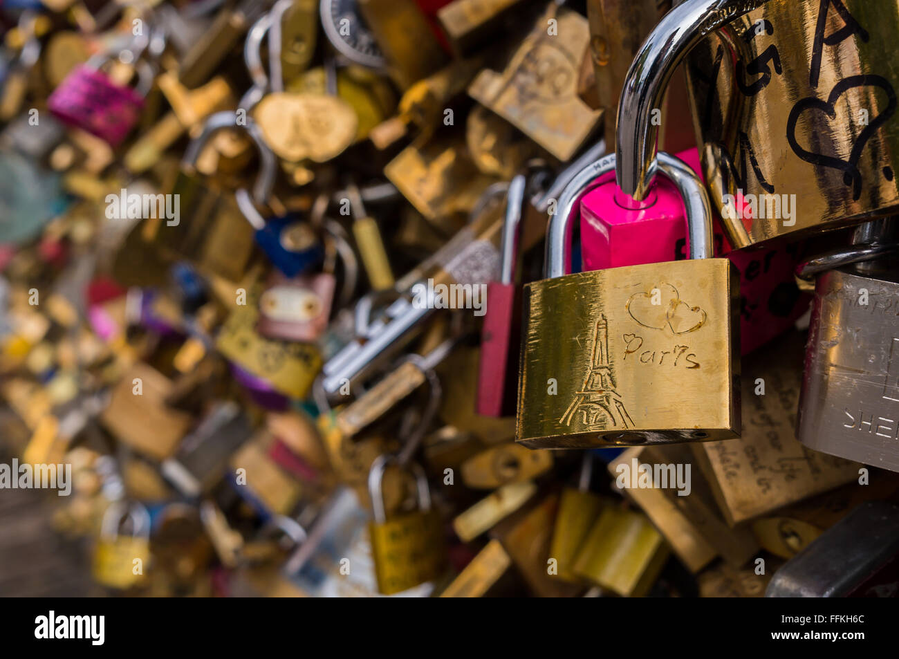 Love lock with hearts and Eiffel Tower symbols, on the Pont des Arts bridge in Paris, France Stock Photo