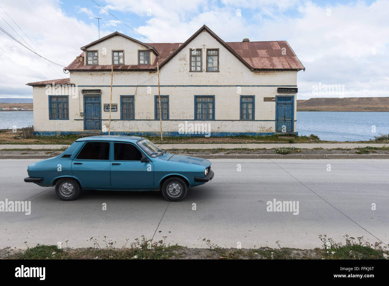 A car and an old house in Porvenir, Tierra del Fuego Stock Photo