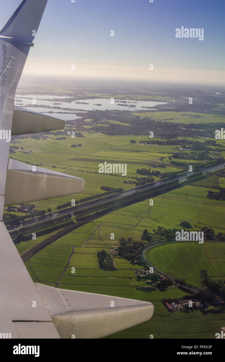 Winglet (Wingtip) and aerial view on Amsterdam (North Holland, The Netherlands) during flight from Verona Villafranca Internatio Stock Photo