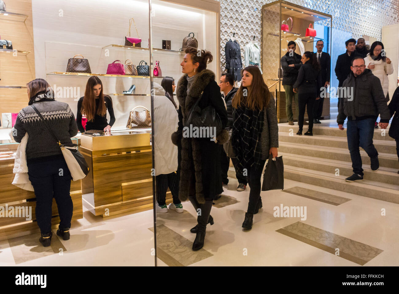 Paris, France, Crowd of People Shopping, inside Luxury Fashion Label Store, LVMH, Louis Vuitton store, Champs Elysees paris shop, shopping tourism fashion Stock Photo