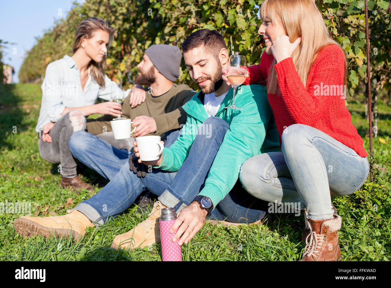 Group of friends taking a break in vineyard Stock Photo