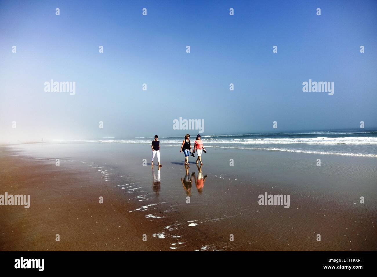 Females walking on beach hi-res stock photography and images - Alamy
