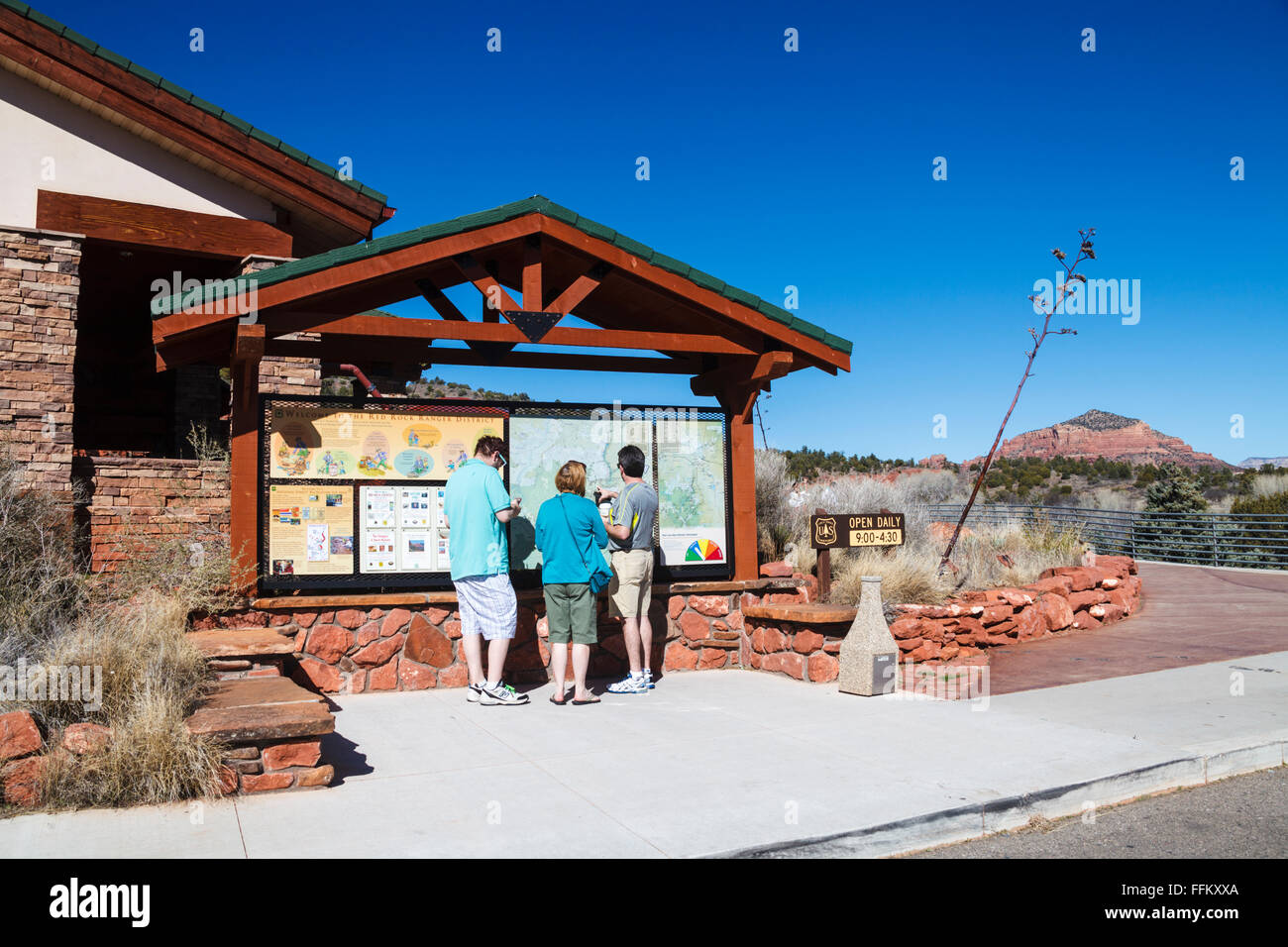 Tourists look at hiking trail map outside the South Gateway Visitor Center near the Village of Oak Creek Stock Photo