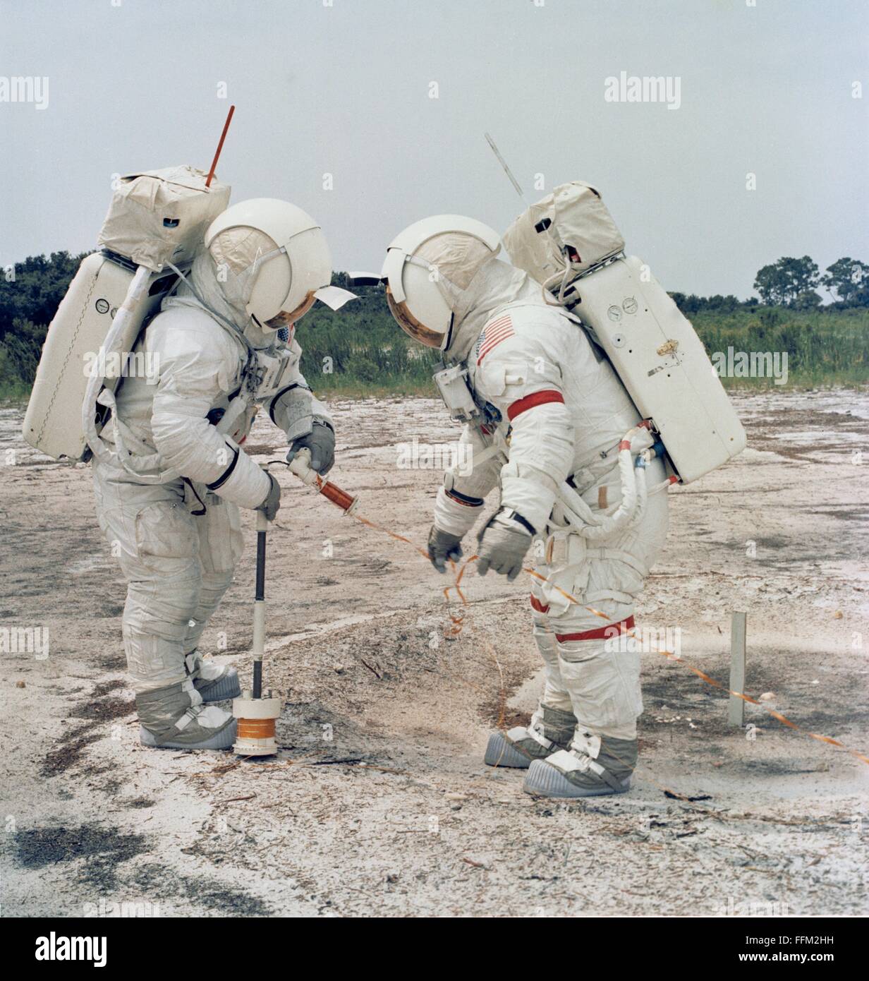 NASA Apollo 14 astronauts Alan B. Shepard Jr. (right), commander, and Edgar D. Mitchell, lunar module pilot, during lunar surface simulation training at the Kennedy Space Center July 18, 1970 in Cape Canaveral, Florida. Stock Photo