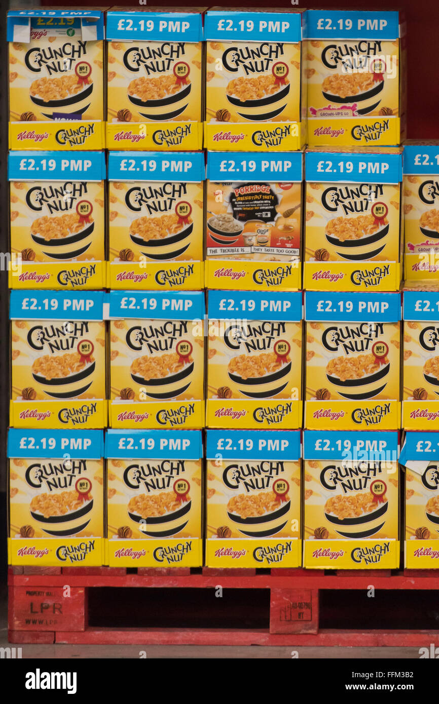 Kellogs Crunchy Nut breakfast cereal stacked up in a store. Stock Photo