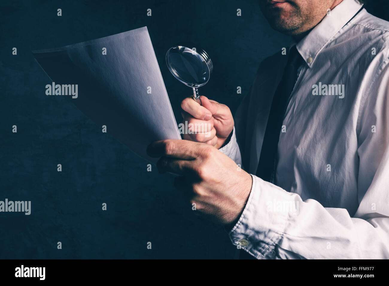 Tax inspector doing financial auditing, businessman reading business report or contract footnotes disclaimer Stock Photo