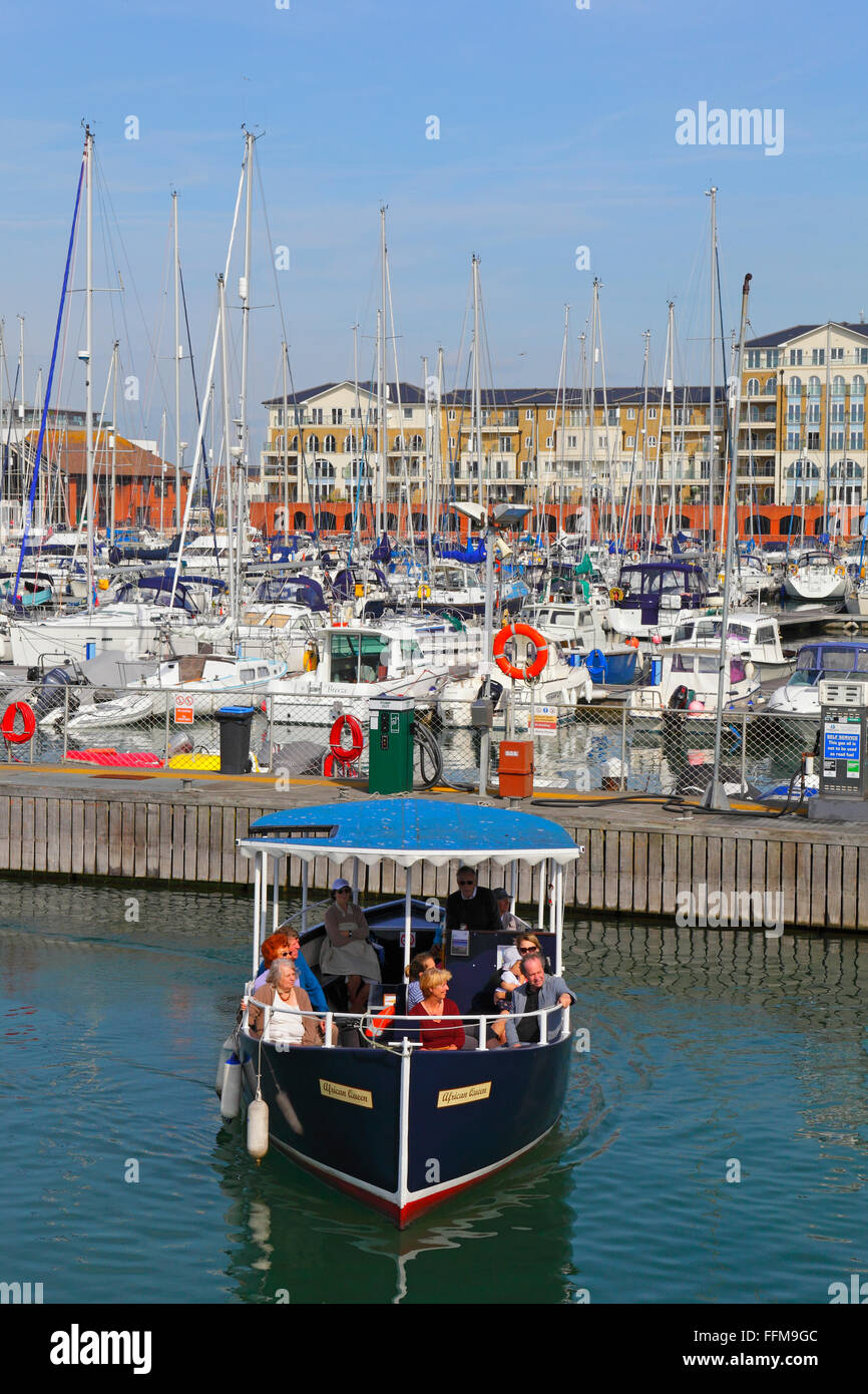 Pleasure boat sightseeing trip round Sovereign Harbour Marina, Eastbourne, Sussex, UK Stock Photo