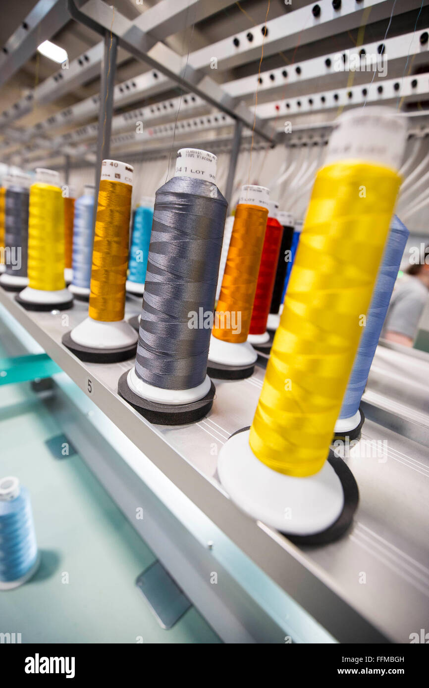 colourful cotton reels in an English factory Stock Photo
