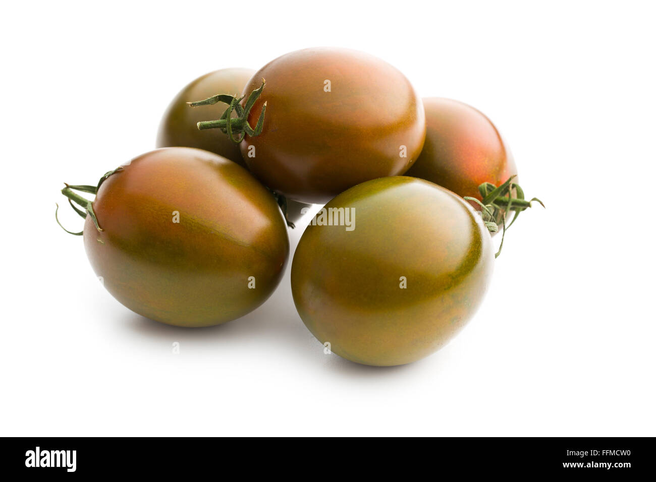 dark tomatoes on white background Stock Photo