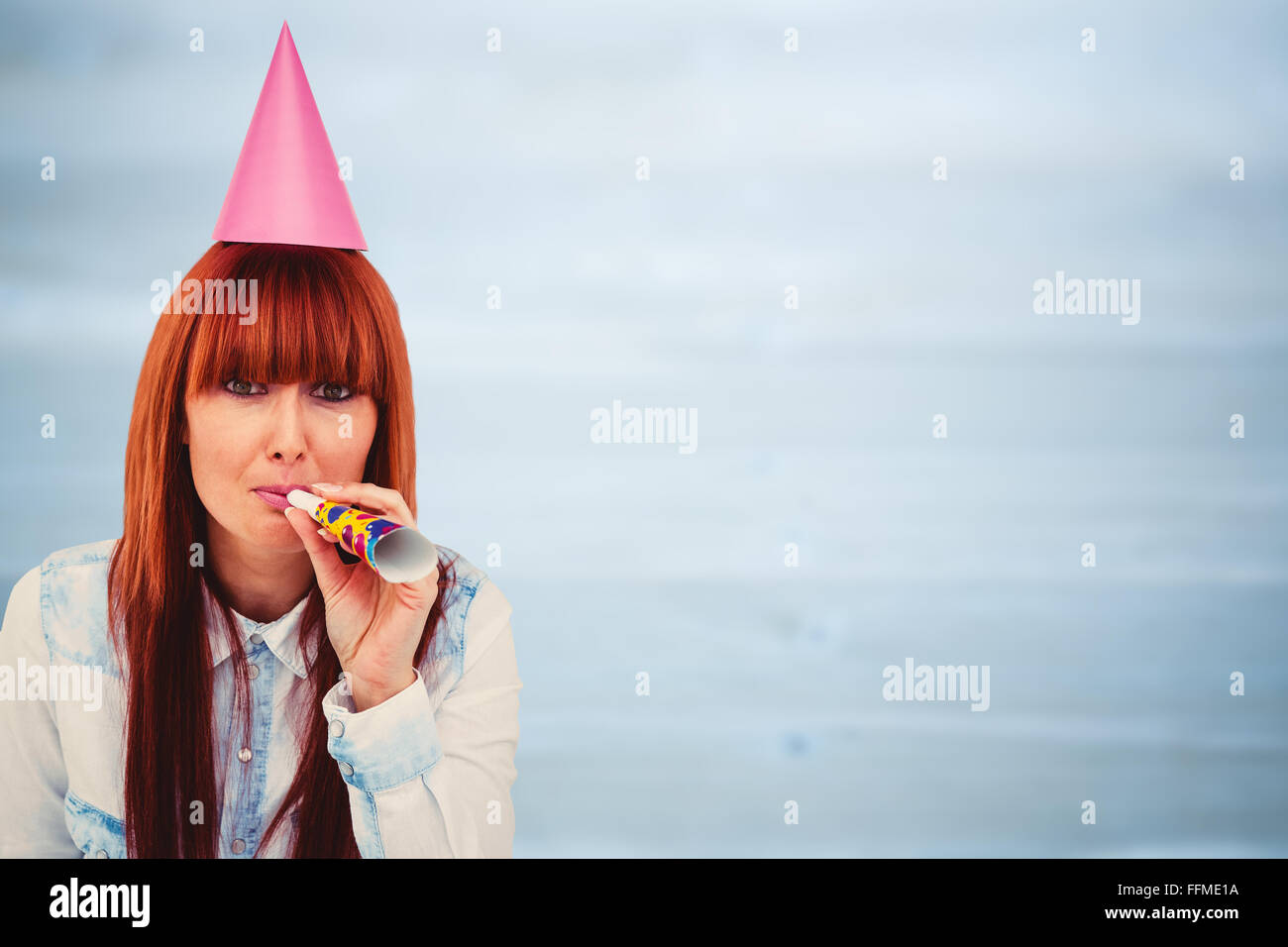 Composite image of smiling hipster woman wearing hat party Stock Photo