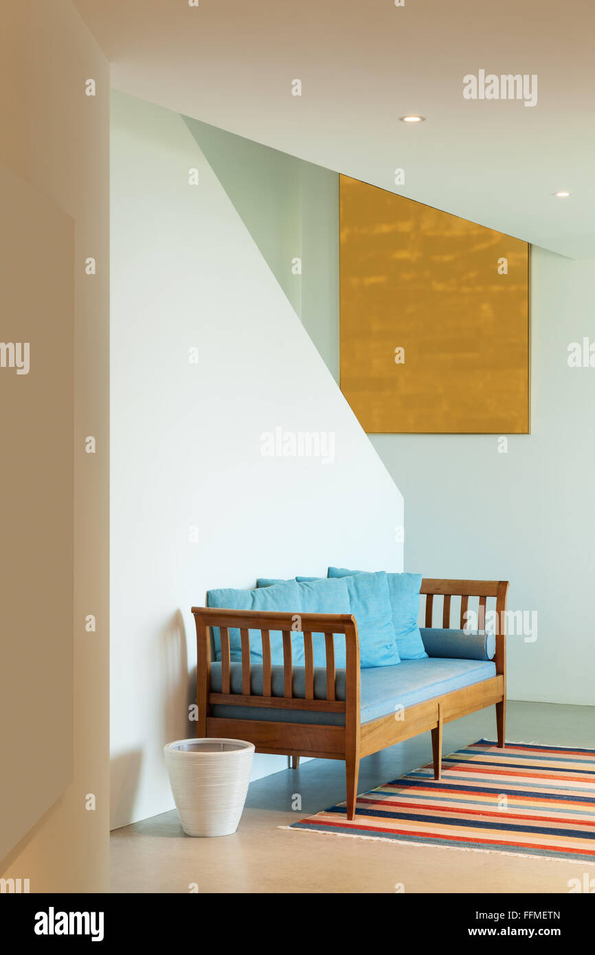 Interior of a modern house, hall with divan and striped rug Stock Photo ...