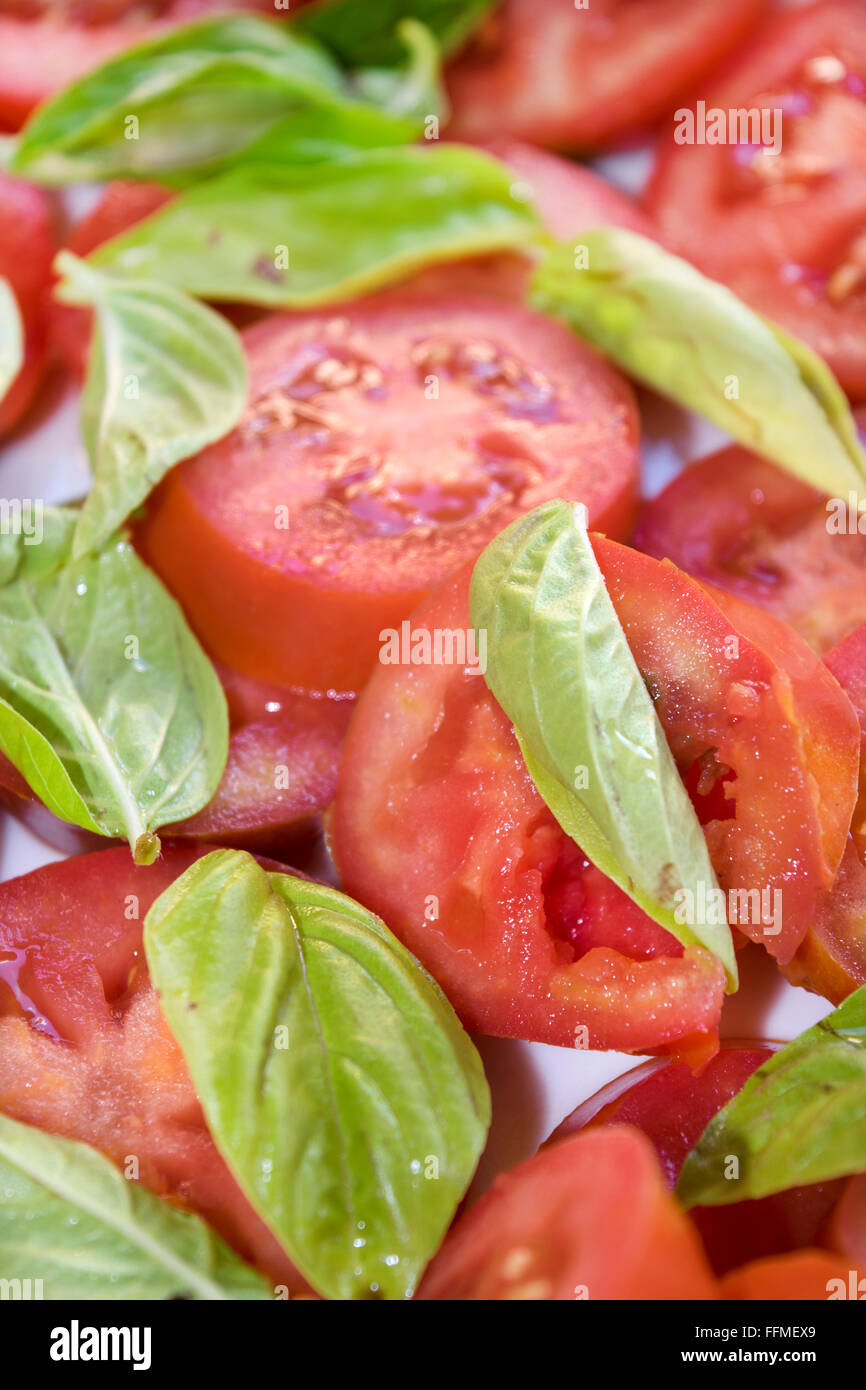 slices of fresh tomato and organic basil Stock Photo - Alamy