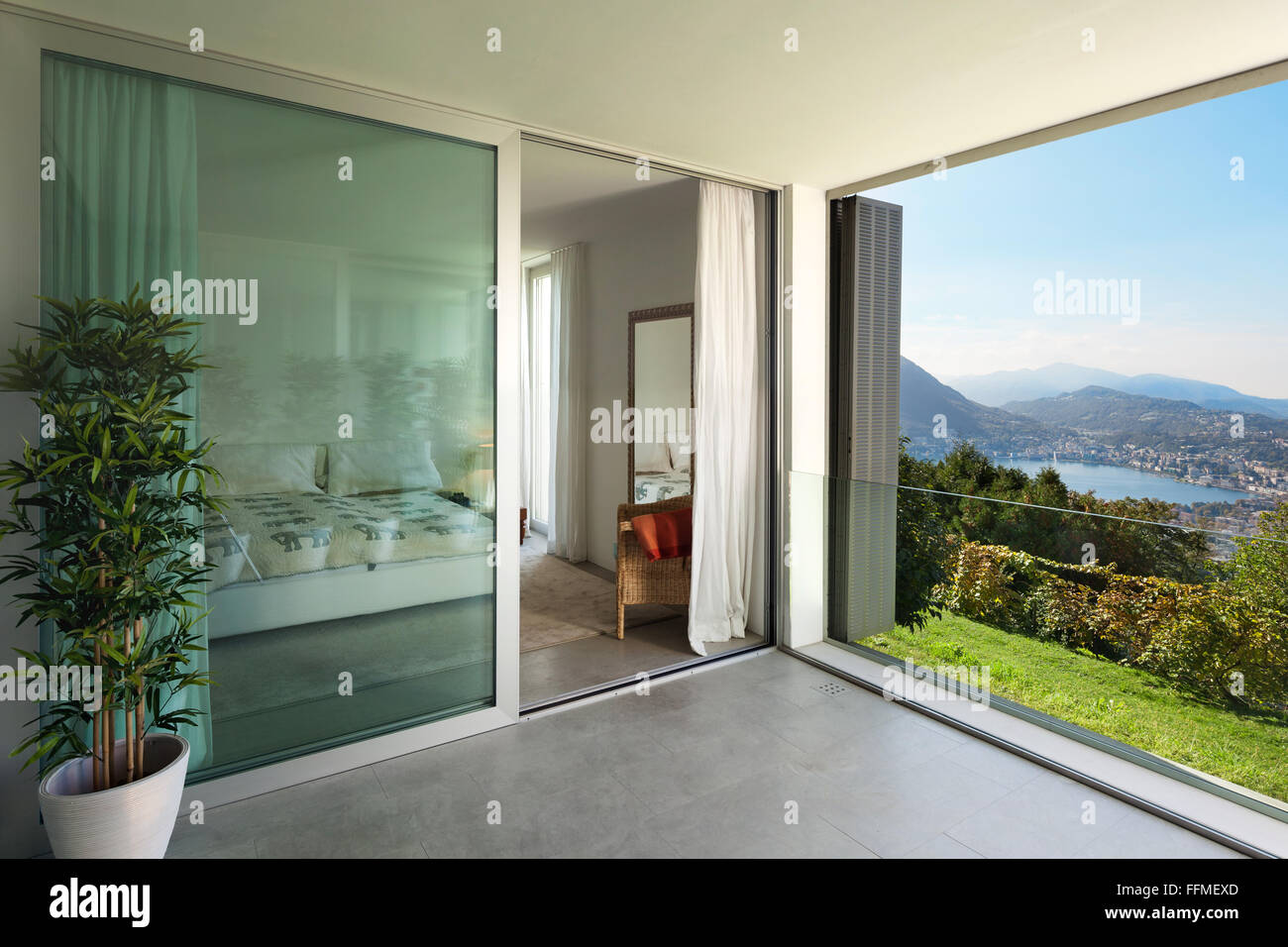 Interior of a modern house, balcony overlooking the lake Stock Photo