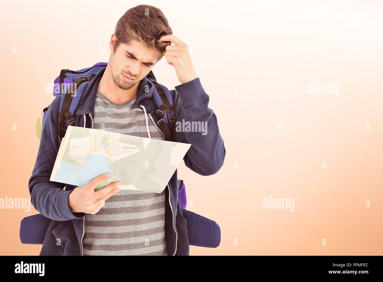 Composite image of man scratching head looking in map Stock Photo