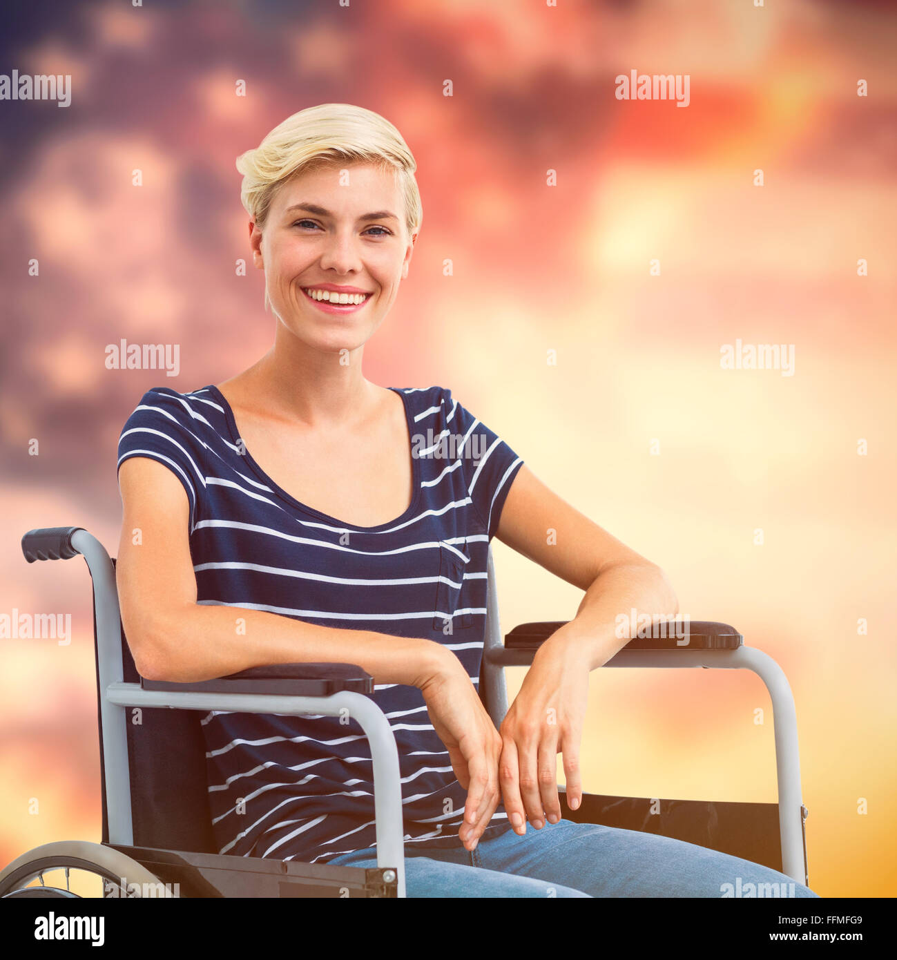 Composite image of smiling woman in a wheelchair Stock Photo - Alamy