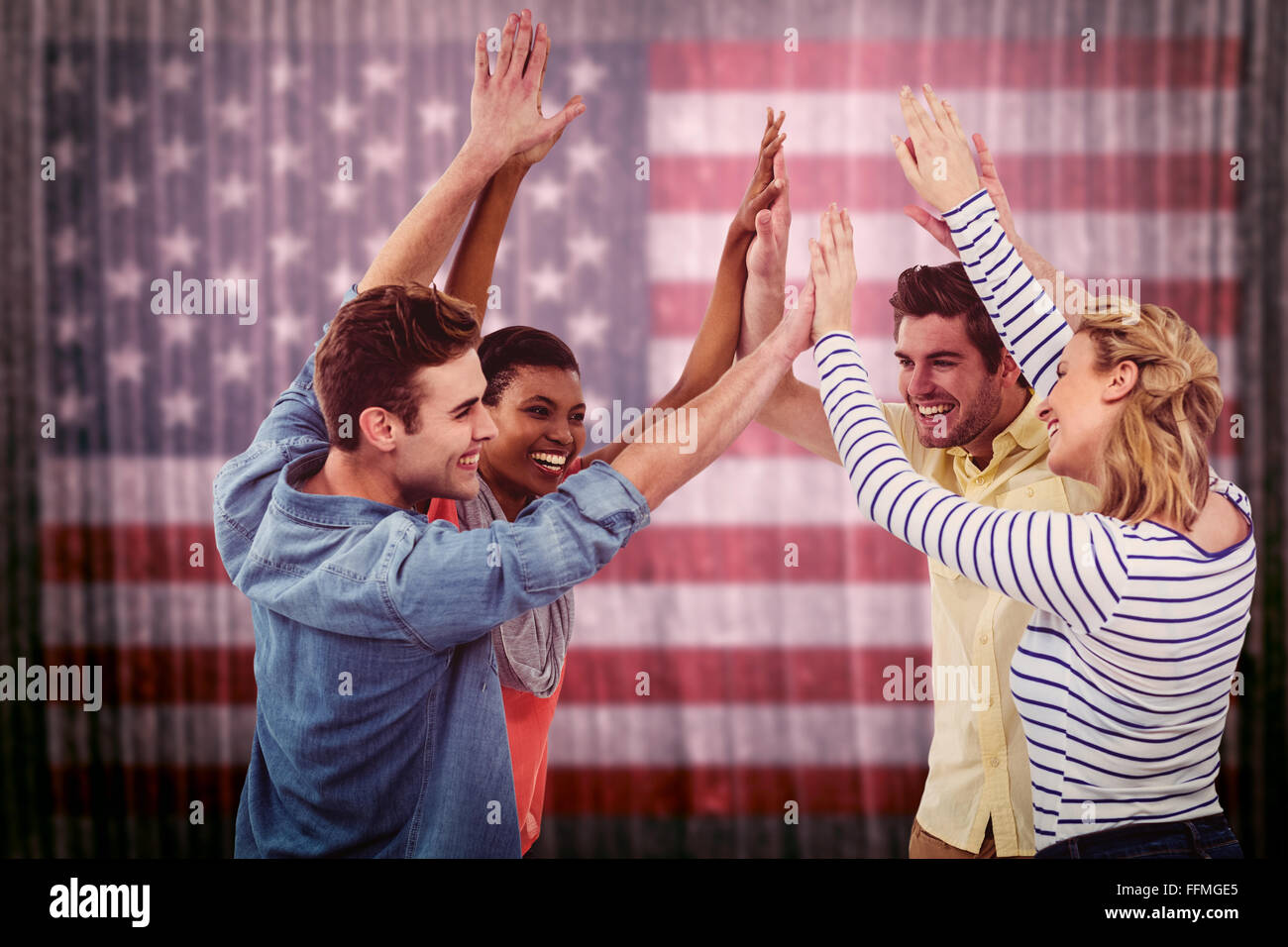 Composite image of happy creative team giving high fives to each other Stock Photo