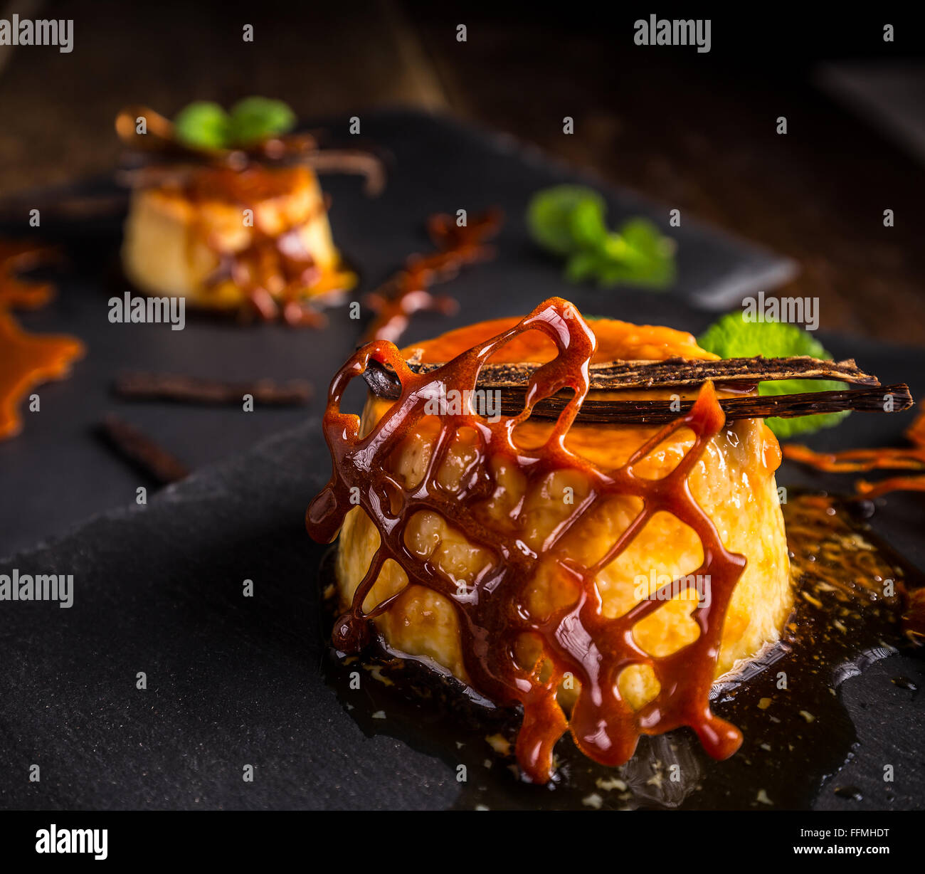Close up of caramel pudding with vanilla and caramel decoration Stock