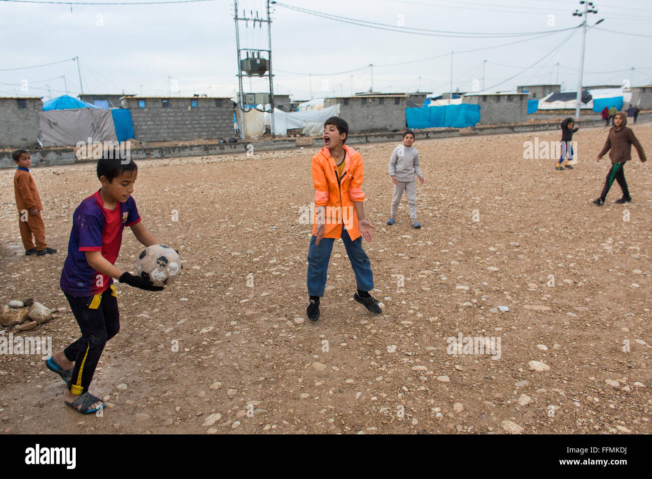 children playing football in Salarara refugee camp, Iraq Stock Photo